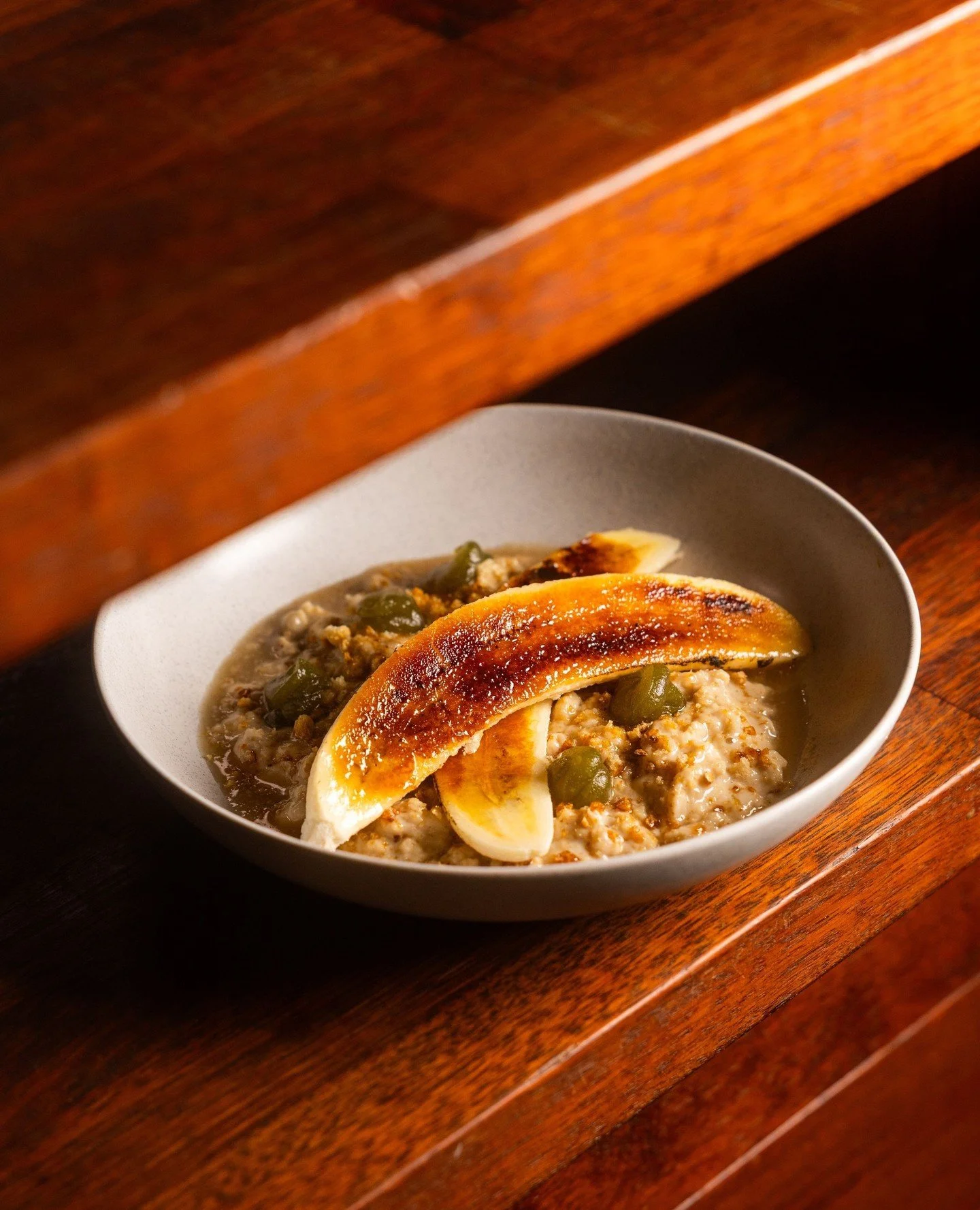 The banana miso porridge 🍌⁠
⁠
A star on our winter new winter menu. We ferment our house bread with koji for a month to create a rich miso paste, and use banana skins for a delicious syrup to pour over the top. Finished with a flamed banana and a to
