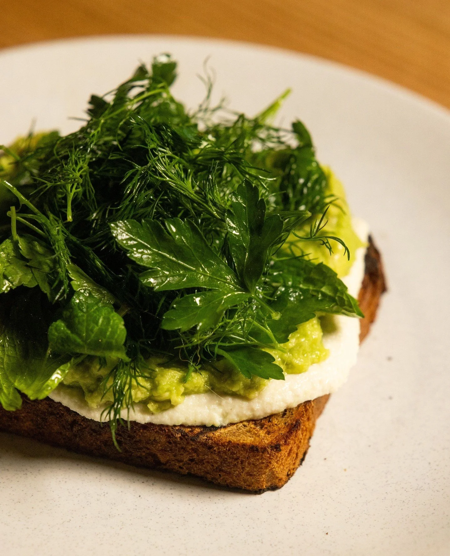 Tartine time 💚⁠
⁠
Meet the new Avocado &amp; Herb Tartine!⁠
⁠⁠
House rye sourdough grilled over flames, spread with macadamia cream, smashed avo, and topped with dill, parsley, mint, and tangy lemon aspen.⁠
⁠⁠
Built for bright mornings. Come grab a 
