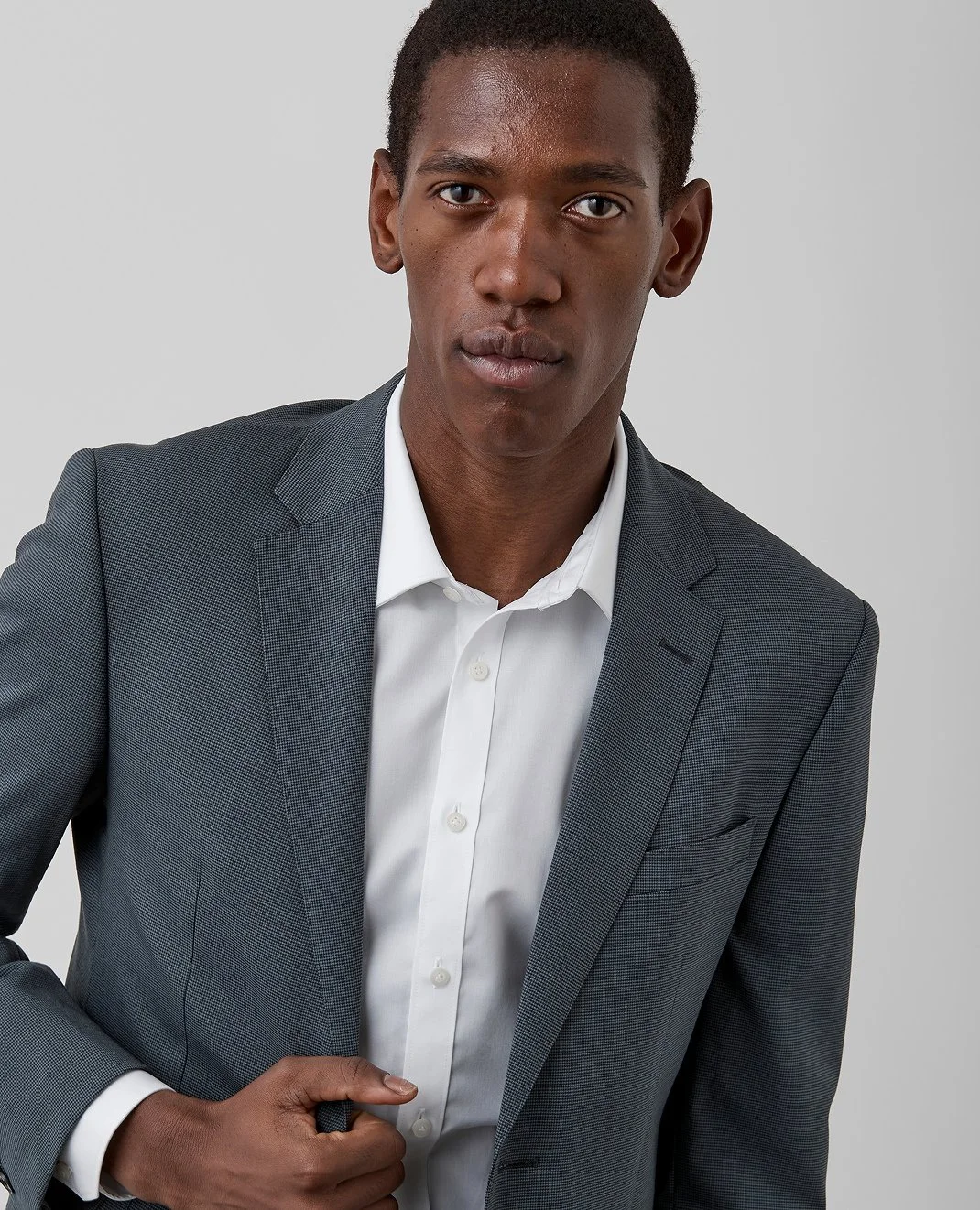 Timeless puppy tooth check in a versatile earthy green - it's gotta be the Brixton jacket.