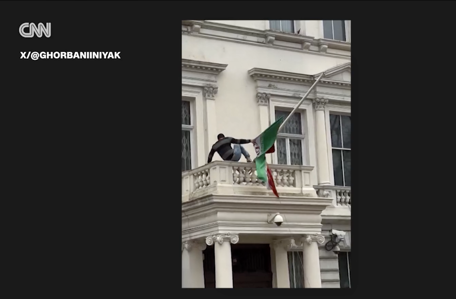 Protester tears down Iranian flag at embassy in London