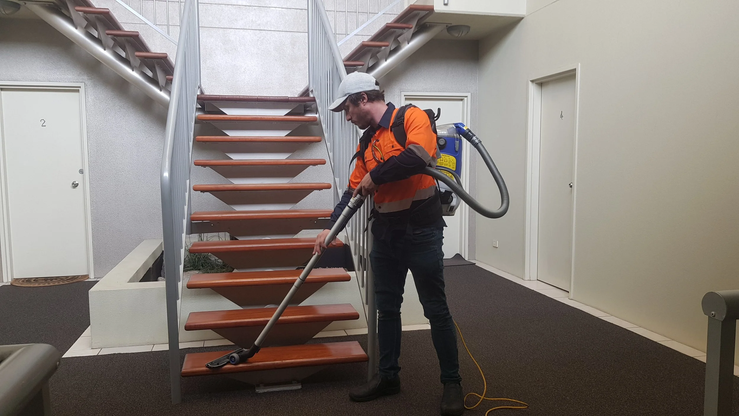 Vacuum carpet foyer and mop hard wood floors and tiled areas