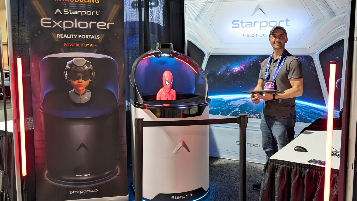 A man stands at the Starport booth during the AWE USA 2026 event, holding a tablet next to a Starport Explorer device displaying a 3D red character bust.