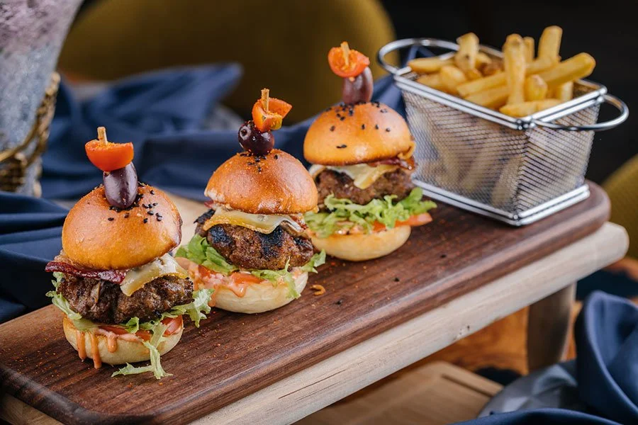 Mini beef slider served with crispy fries in a rustic presentation — a gourmet street food-style burger perfect for Melbourne food truck dining.