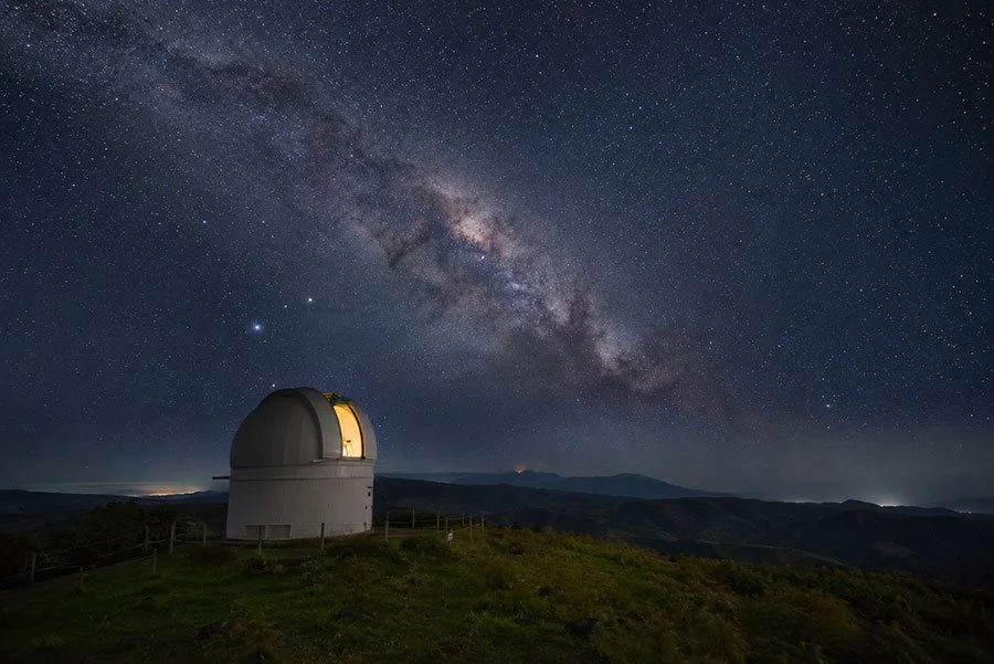 Telescope dome of Maleny Observatory against a clear dark night sky with visible star clusters above Queensland hinterland