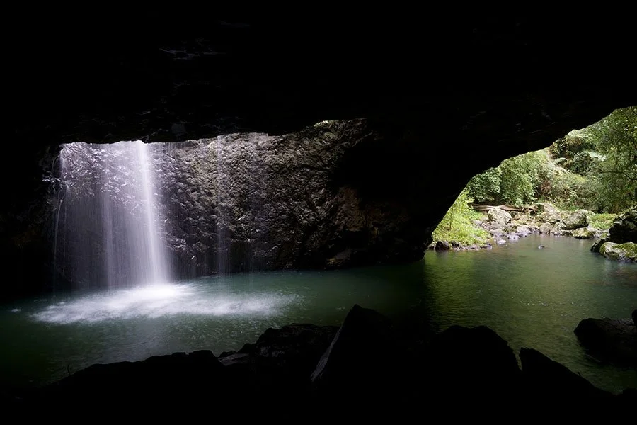 Natural Bridge waterfall at Springbrook National Park – a magical rainforest escape with glow-worms and winter mist in Queensland’s hinterland