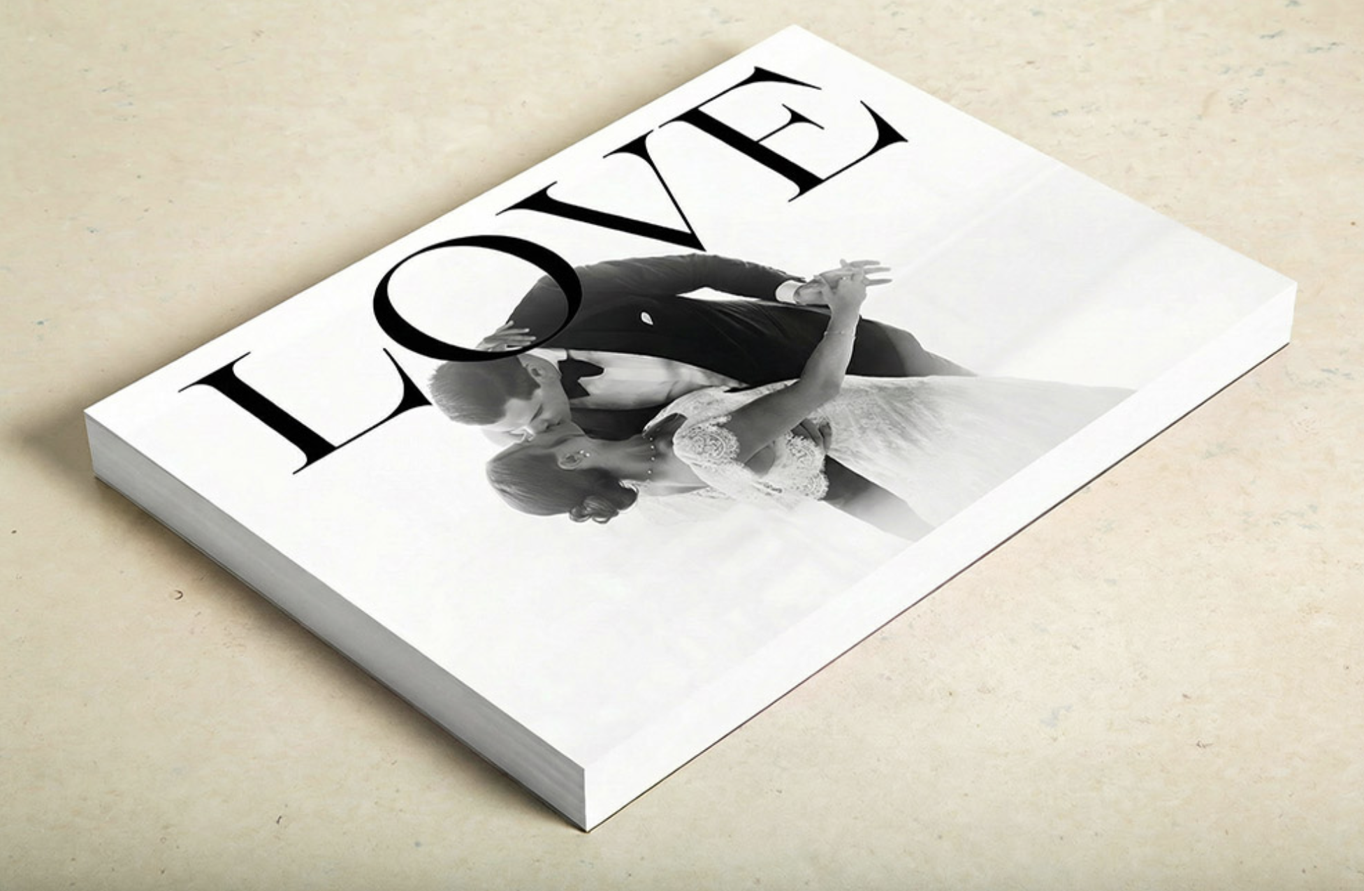 Fashion magazine cover featuring a black and white photo of a man and woman dancing, with the word "LOVE" prominently displayed at the top.