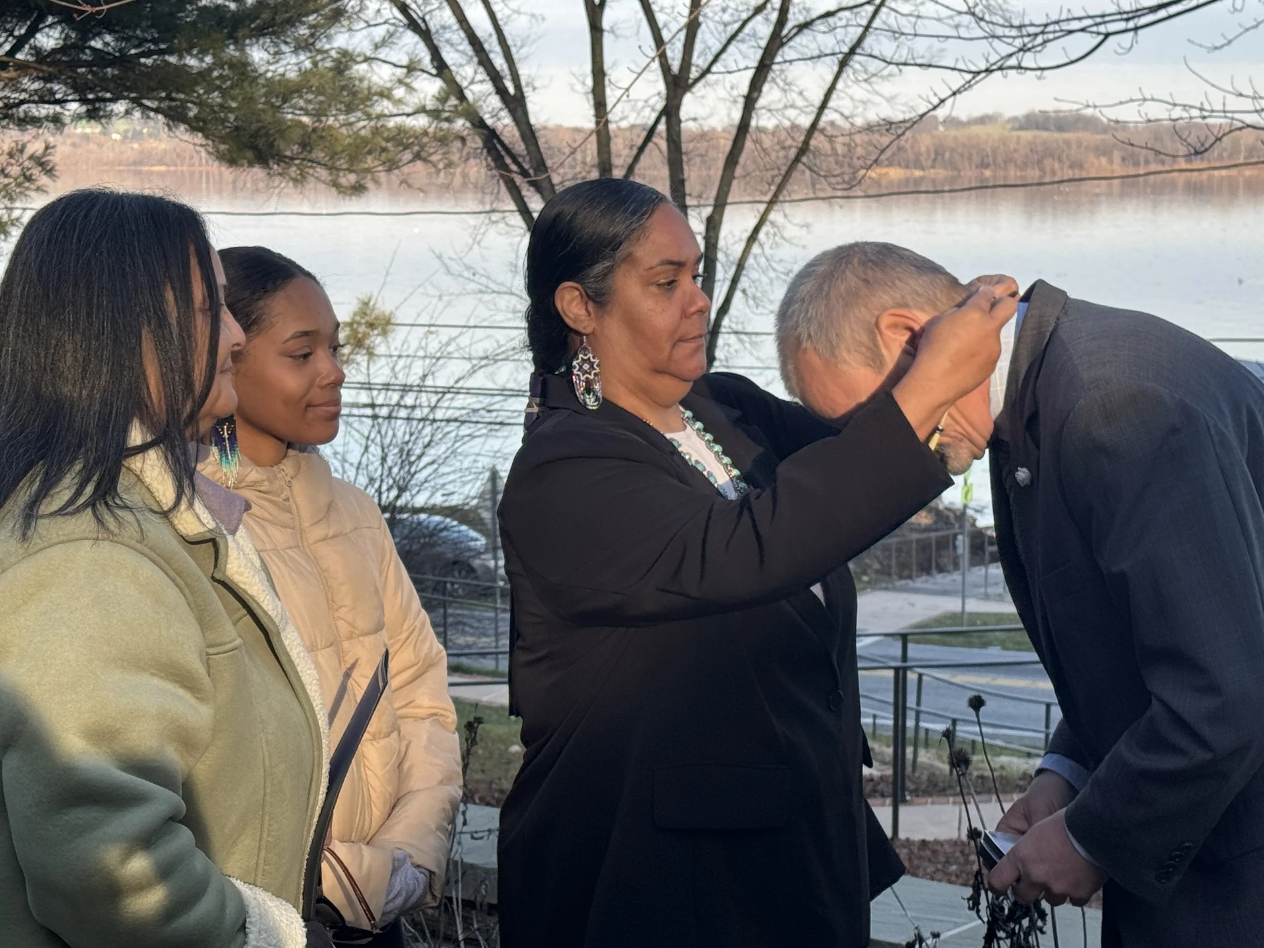 Turtle Clan Mother Tiffany Johnson presents Mayor Michael Helfrich with a beaded medallion to celebrate our recognition from the city of York.