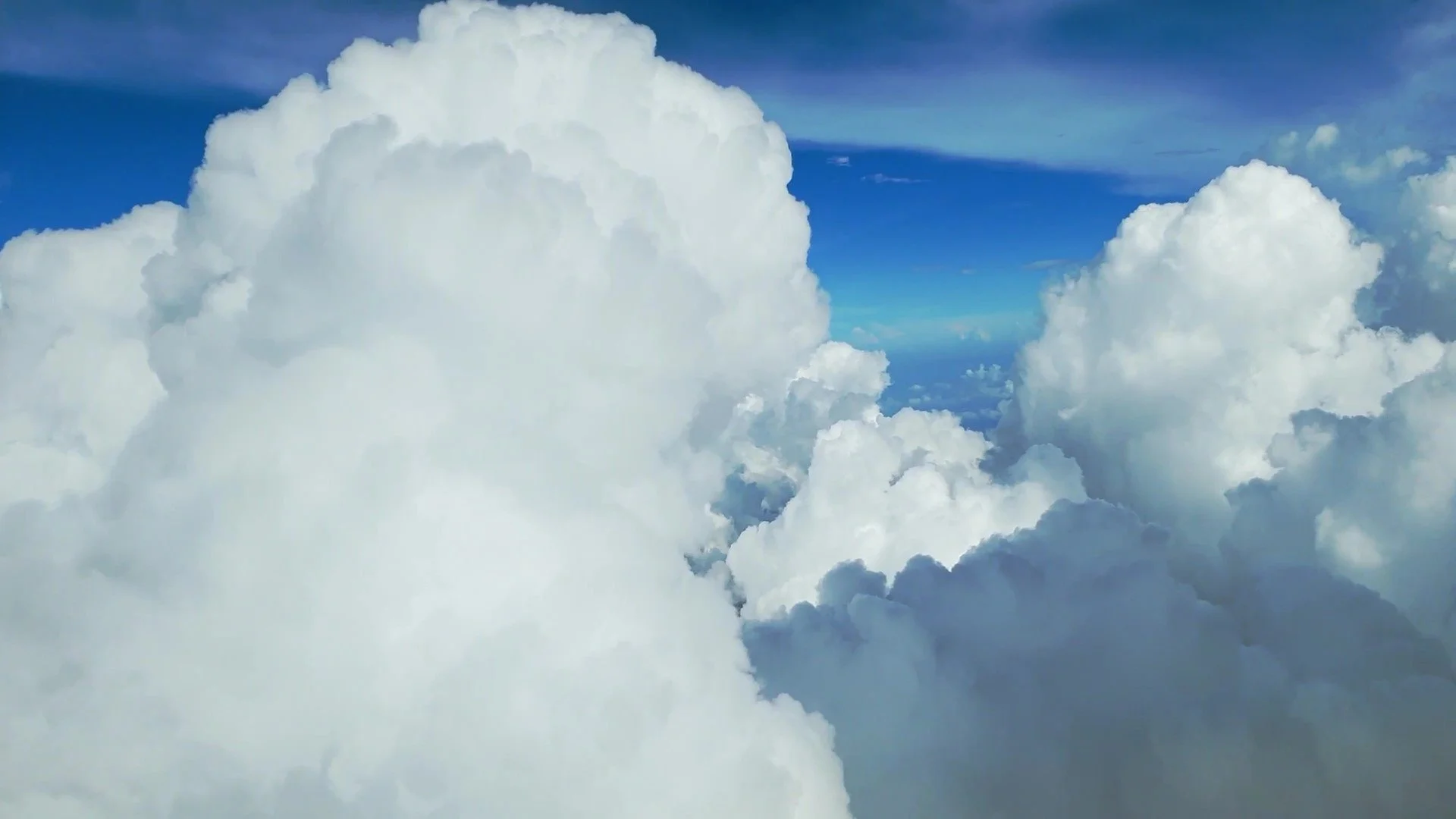 115239131-flying-through-cumulus-clouds-_H264HD1080 - frame at 0m4s.jpg