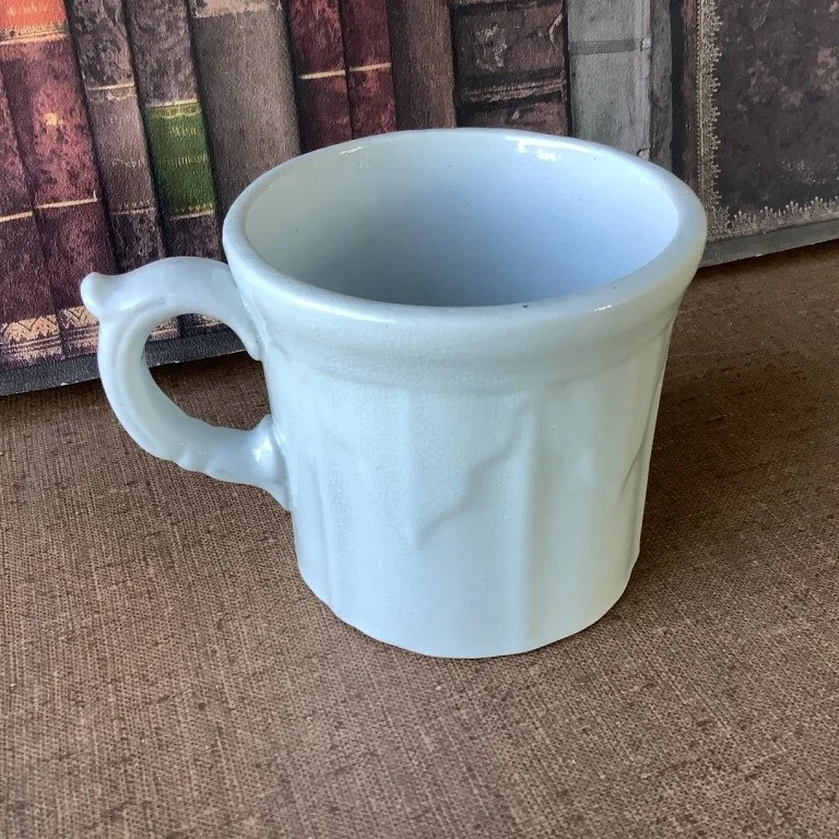 (#23.12)  Baltic Shape Mug;  3-1/2”H, 3-3/4” Diam.;  partial impressed mark is unreadable;  registered 1855.  Fine condition with fine overall crazing.  $85.