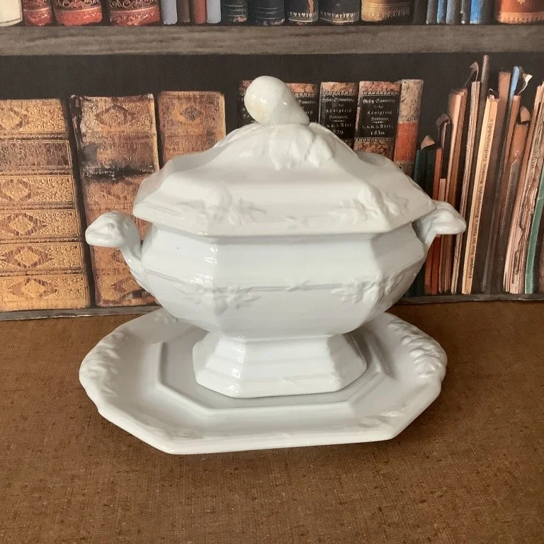 (#23.59) Fig/Union Shape Sauce Tureen with Undertray; 7-1/2” H, 8-1/2” L handle to handle, undertray is 9” L; base and undertray impressed Davenport with registry diamond.  Registered 1856.  Fine condition.  $125.