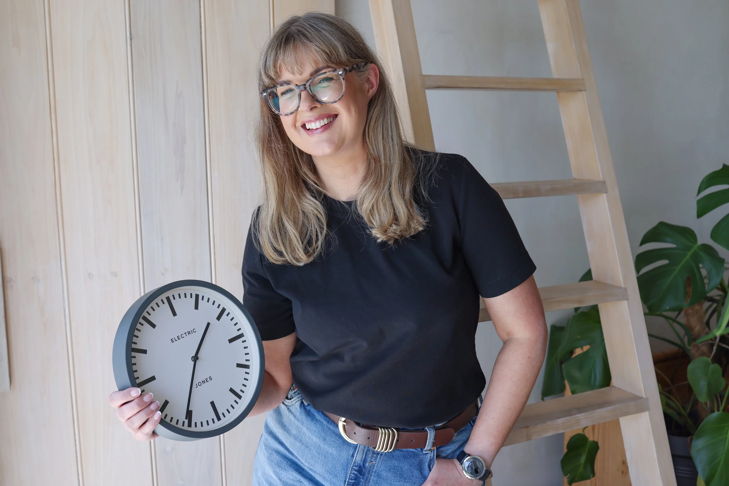Sarah Stewart holding a clock