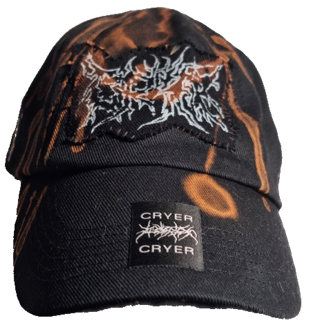 Black beanie hat with orange and white abstract design and a logo that says Cryer.