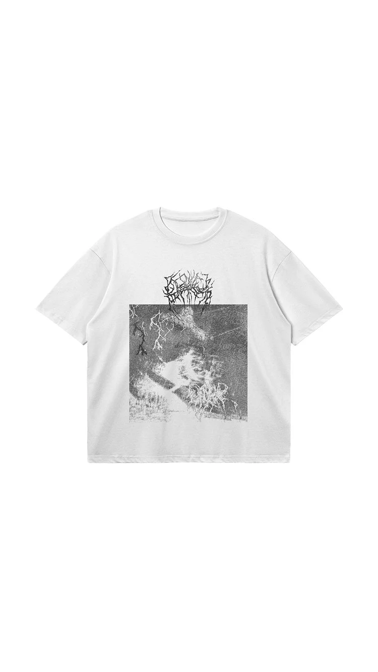White T-shirt with a black and white graphic print of a person's face with abstract, tree-like text above.