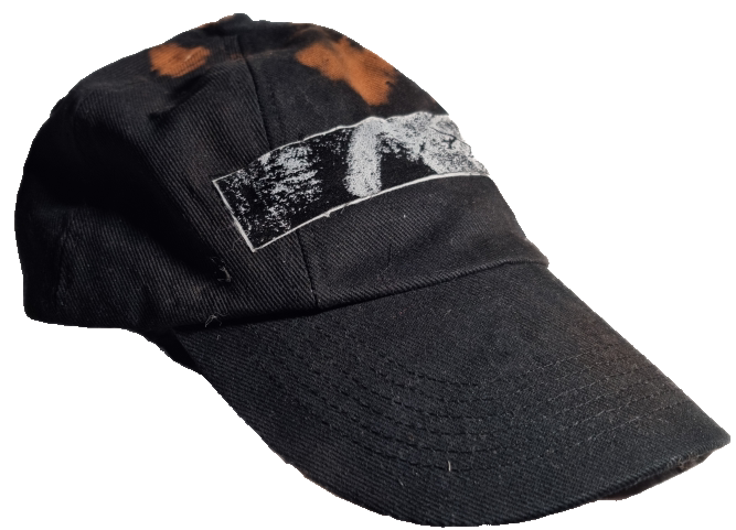 Black baseball cap with white painted or printed design on front