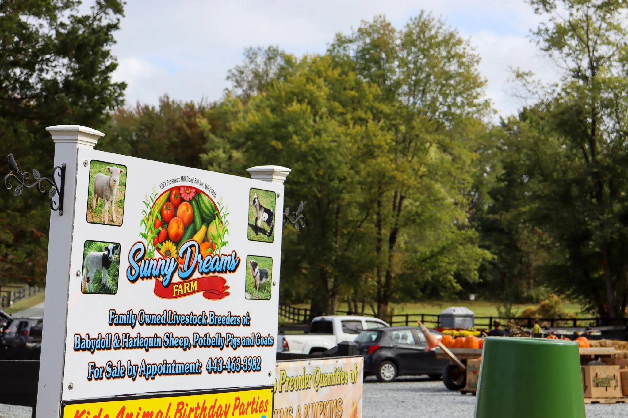 The Sunny Dreams Farm entrance sign welcomes visitors to the family farm and produce stand in Bel Air Maryland.