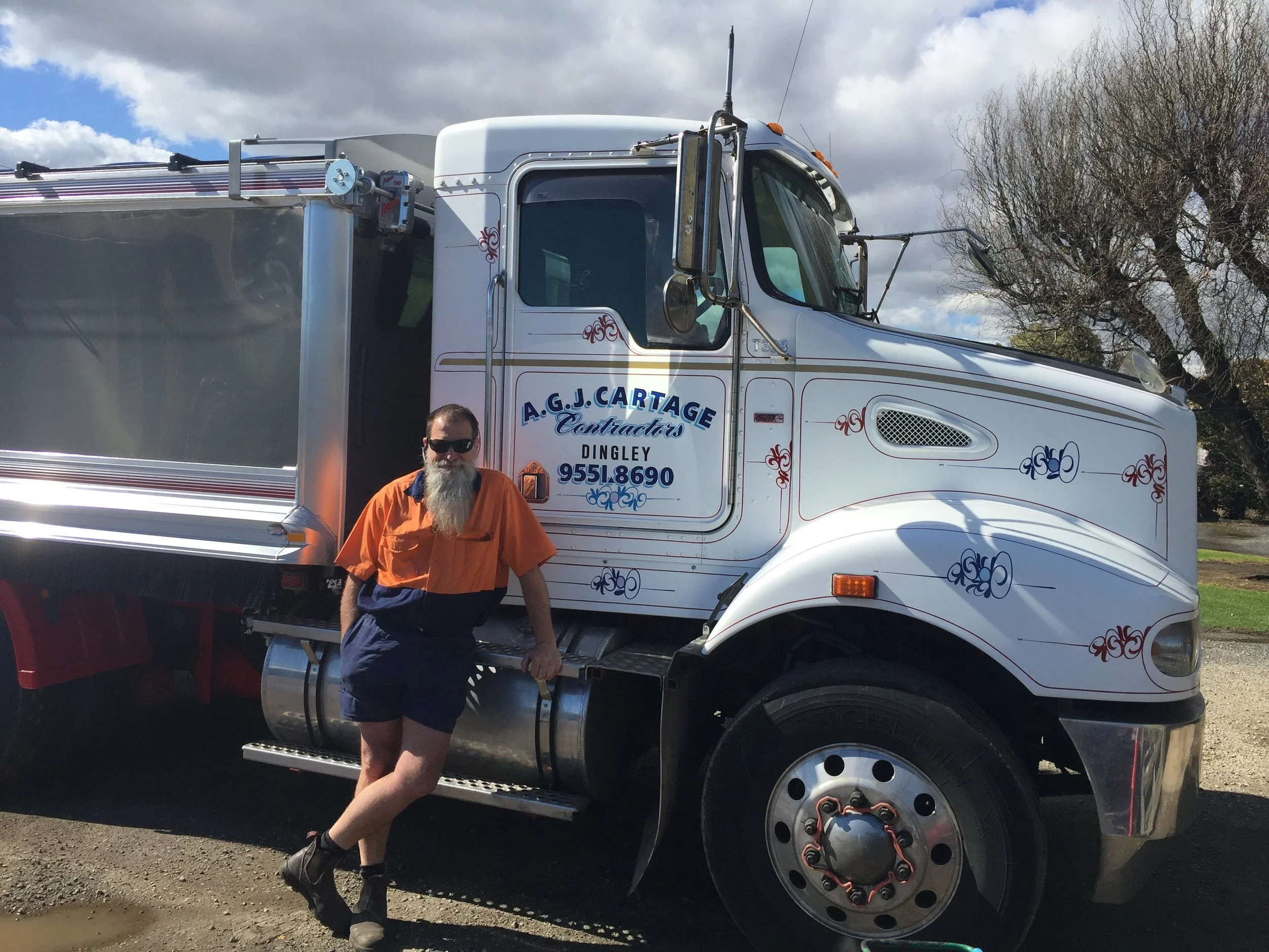 Andrew standing with his new Kenworth T388.jpg