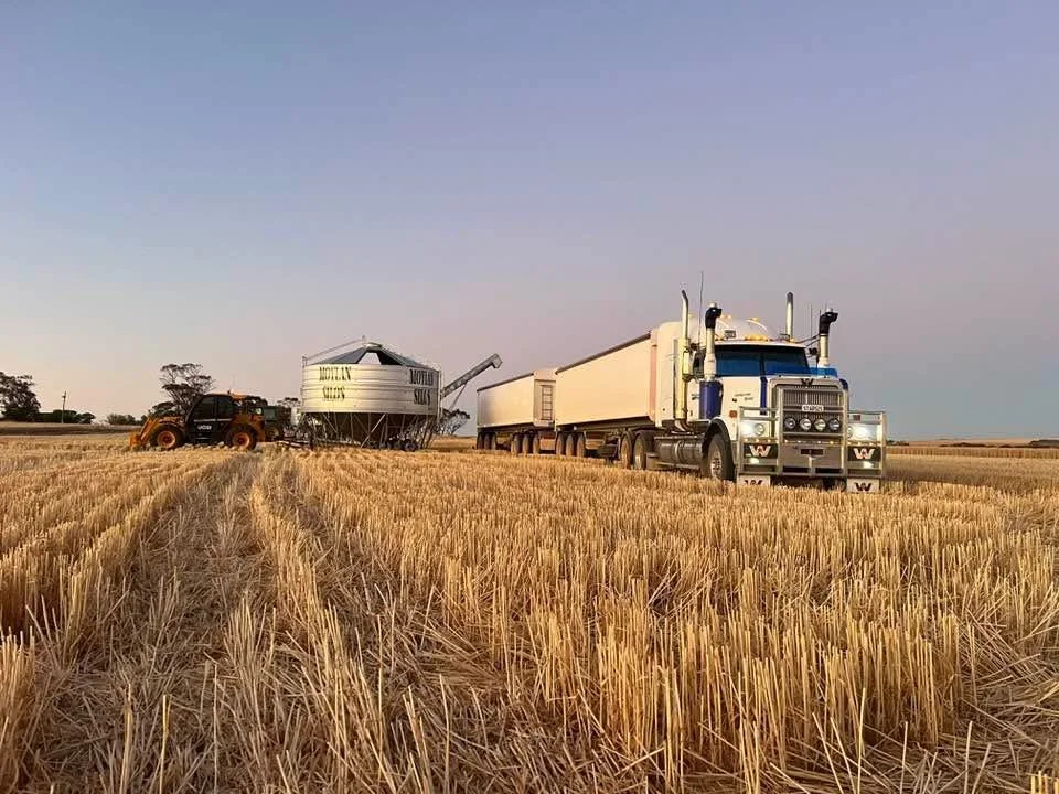 Nick doing grain harvest.JPG