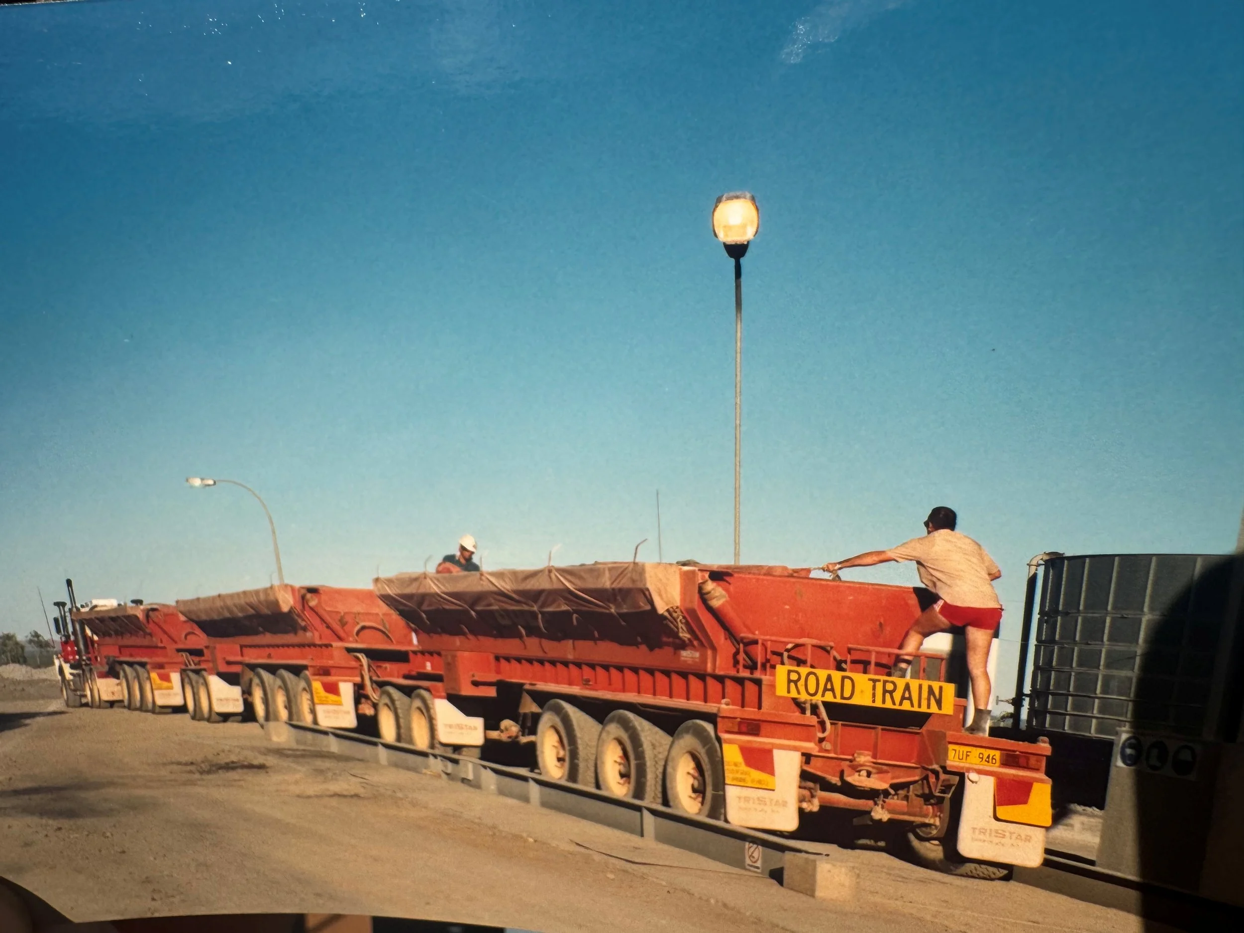 Peter tarping his trailers Cadjebut mine Gulf Transport.jpg