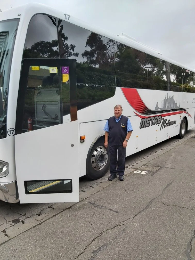 Dennis outside bus.jpg