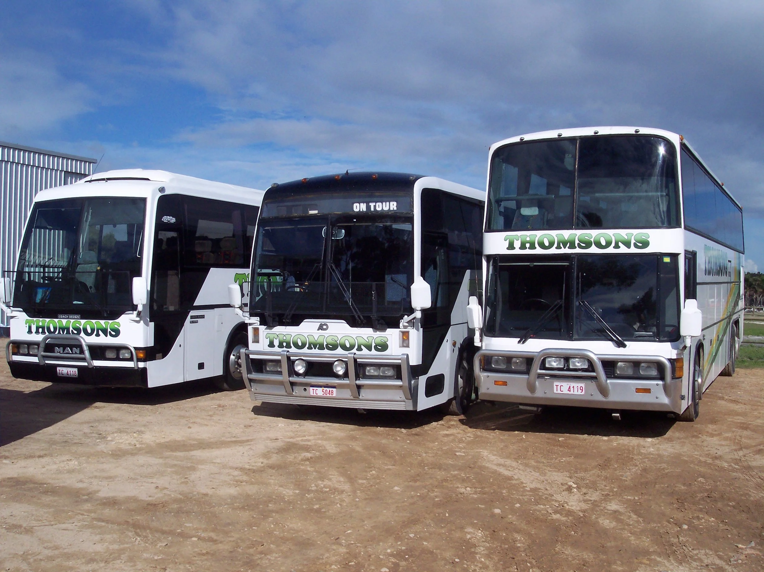 Neville Thomson (#6) 3 large coaches..jpg