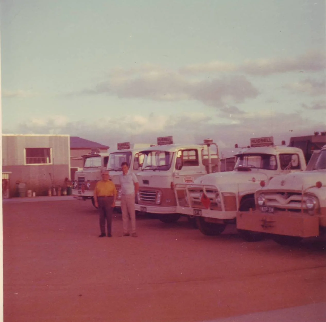 Phil Russell 1974 with father Roy and fleet Eagle Farm.jpg