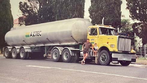 LANGGUTH Dion WITH HIS SON JOSEPH CARTING WATER 1992.jpeg