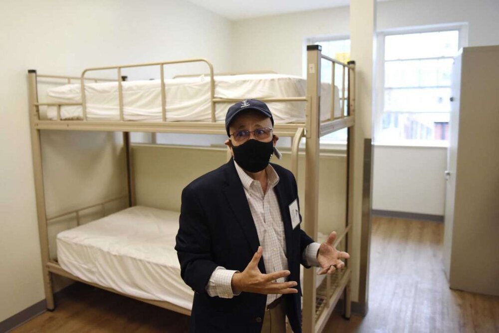  Pacific House Executive Director Rafael Pagan Jr. leads a tour of the new renovated building in Stamford, Conn. Monday, Sept. 29, 2020. The men's emergency shelter held a ribbon cutting Tuesday for its facility that is finishing up a complete interi