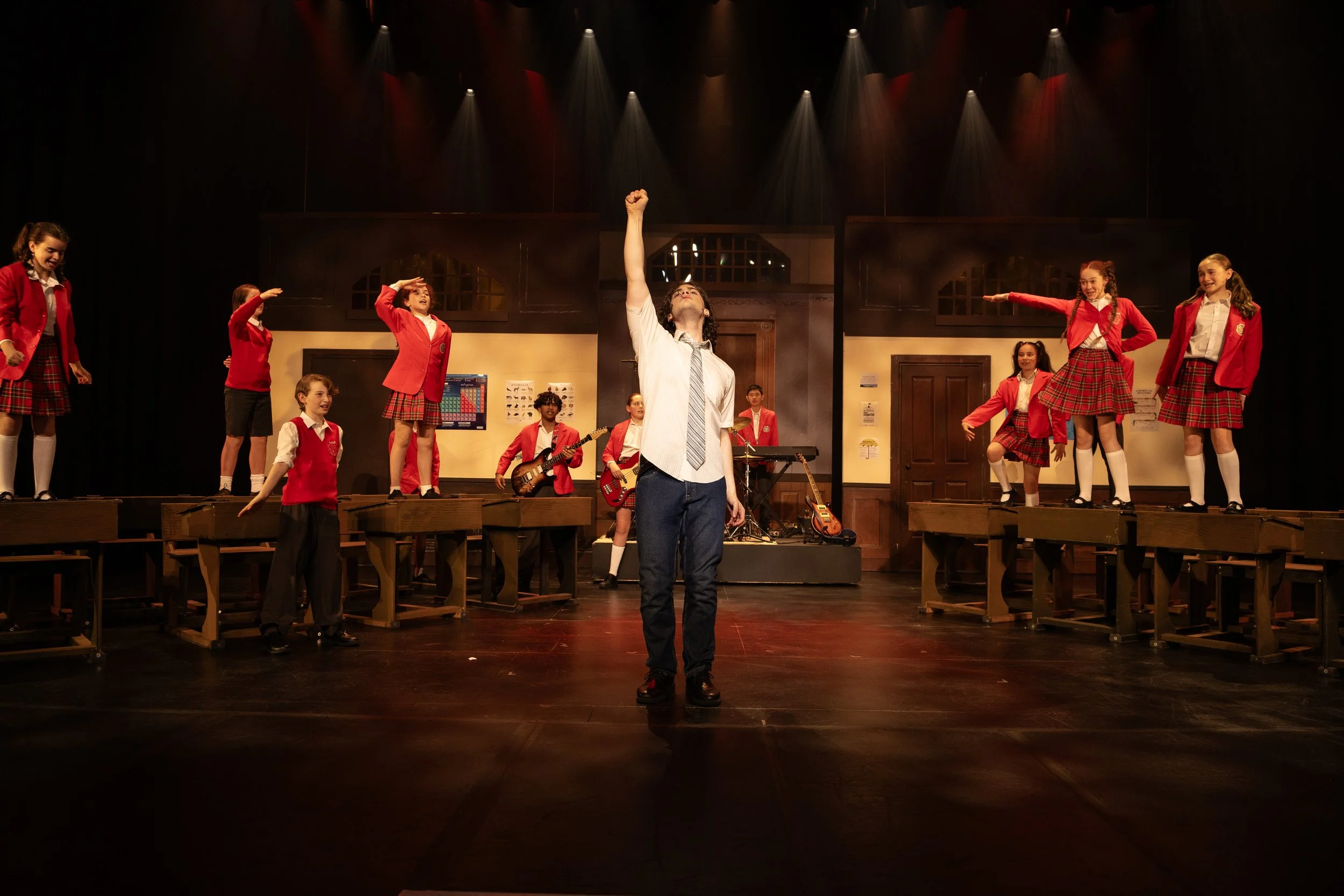 Dewey and the School of Rock students singing together in class during the musical at the National Theatre Melbourne, dynamic production still.