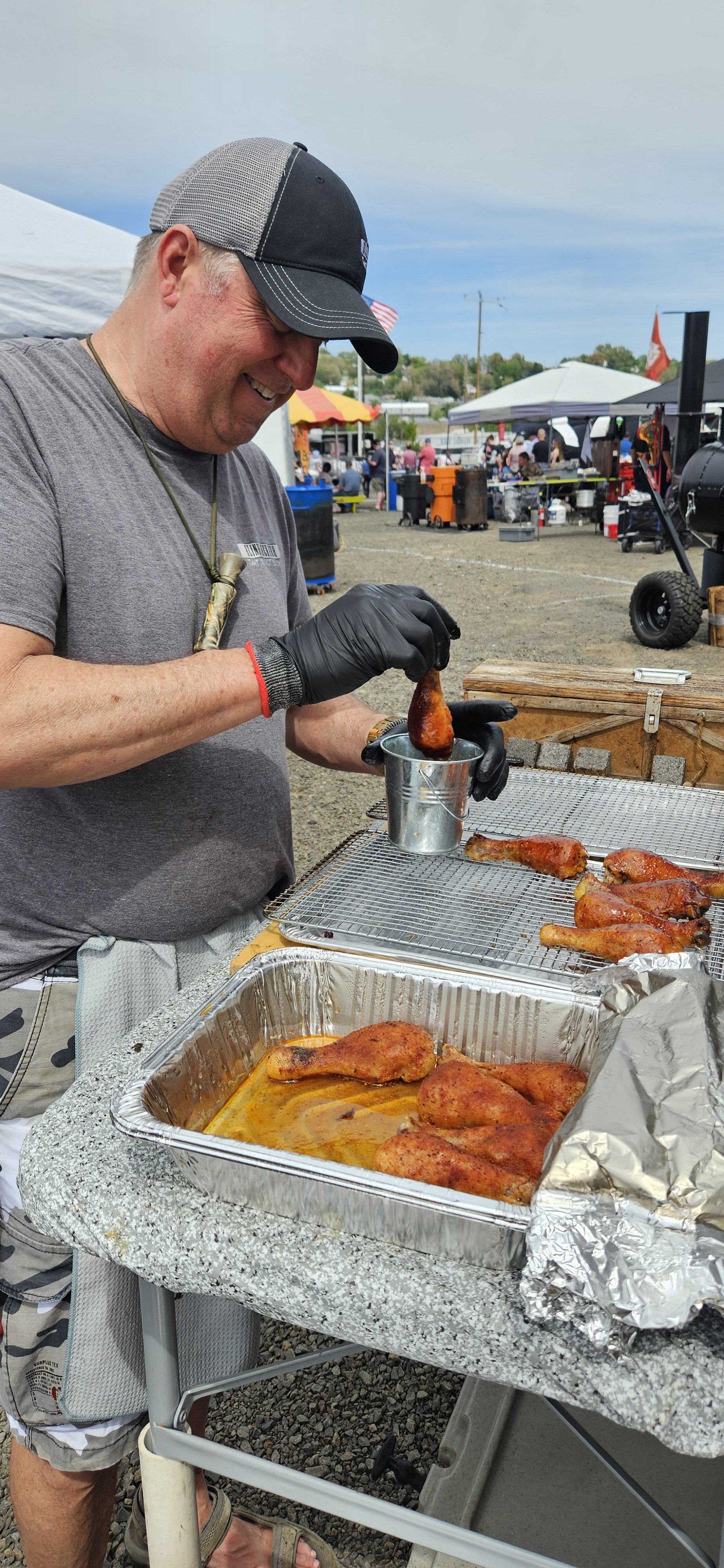 Pit-Matt-ster, Matt Morgan, preparing smoked chicken wings to feed the crowd at a BBQ competition.