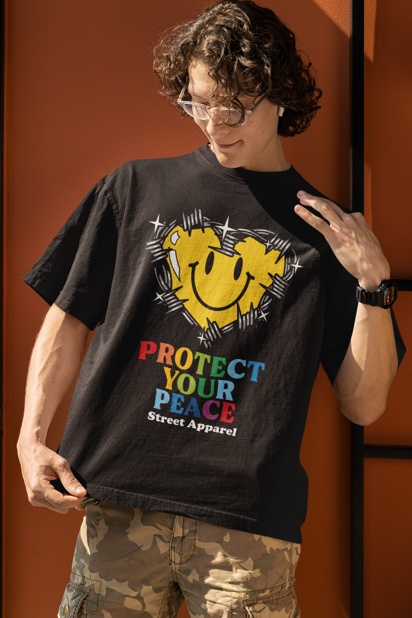 oversized-t-shirt-mockup-featuring-a-smiling-man-with-curly-long-hair-m32077.png