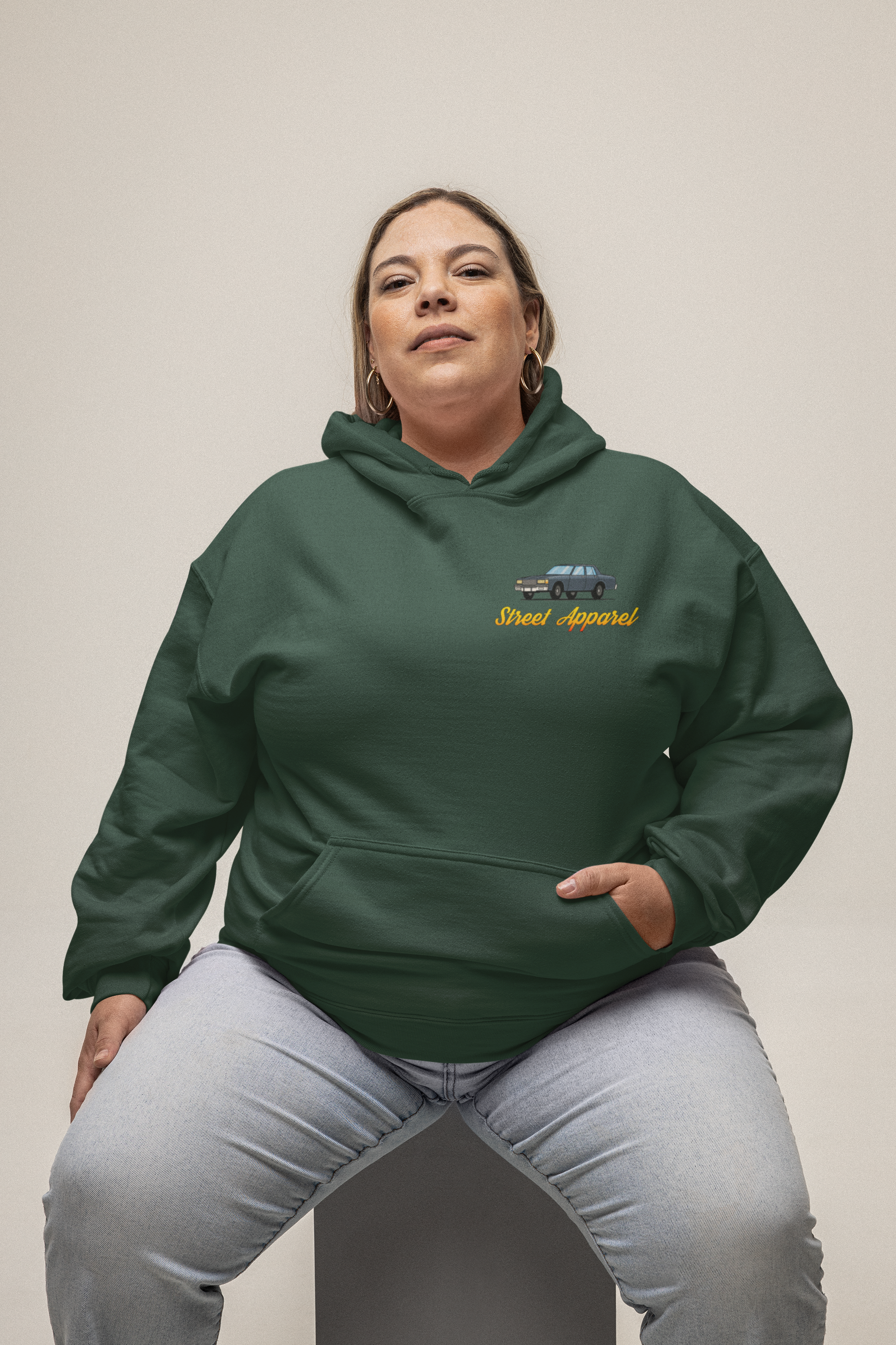 mockup-of-a-woman-wearing-a-plus-size-gildan-pullover-hoodie-in-a-studio-m32948.png