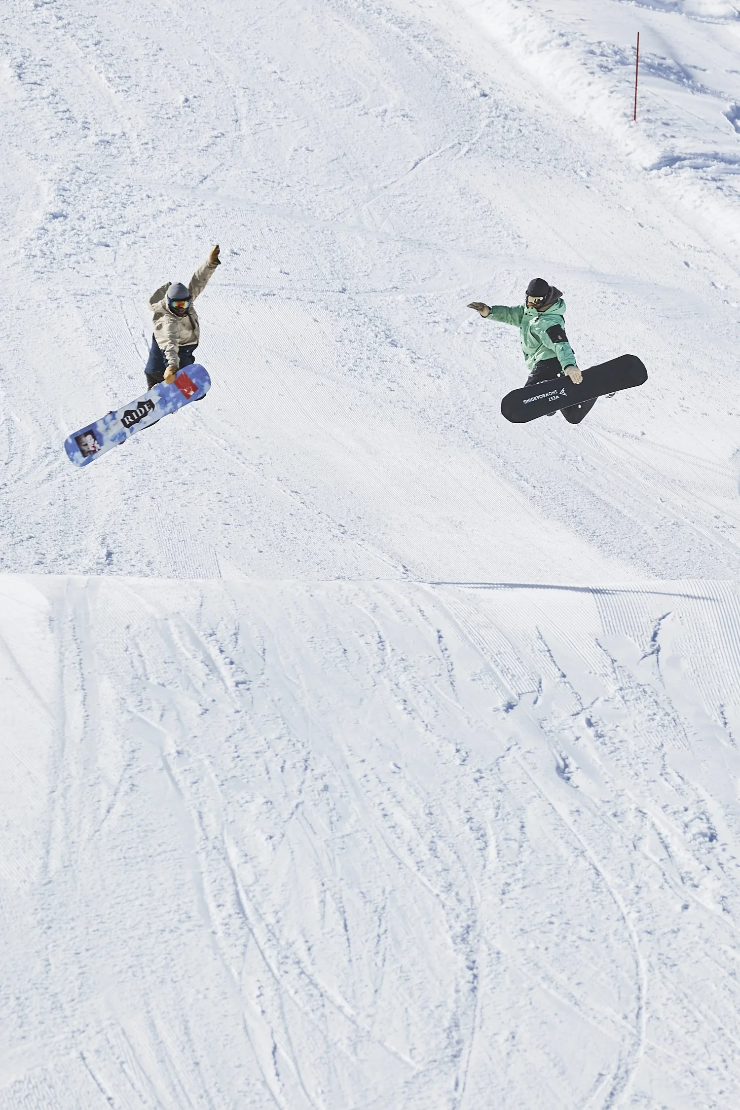 Skier airborne above a snow ramp — photograph by Michaël Gramm