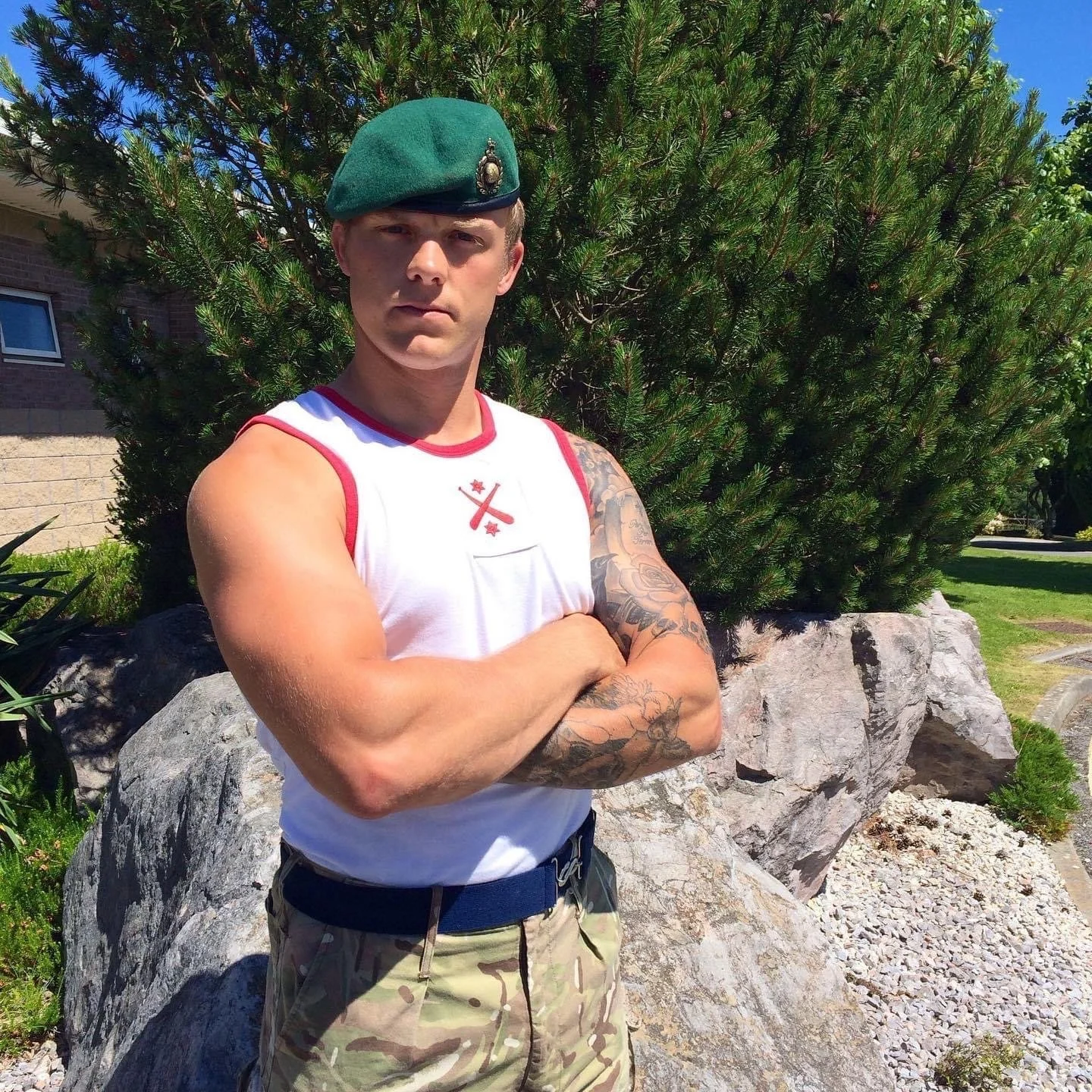 Founder and head coach of Pantheon Plymouth standing outdoors with arms crossed, demonstrating leadership, strength and professional fitness coaching.