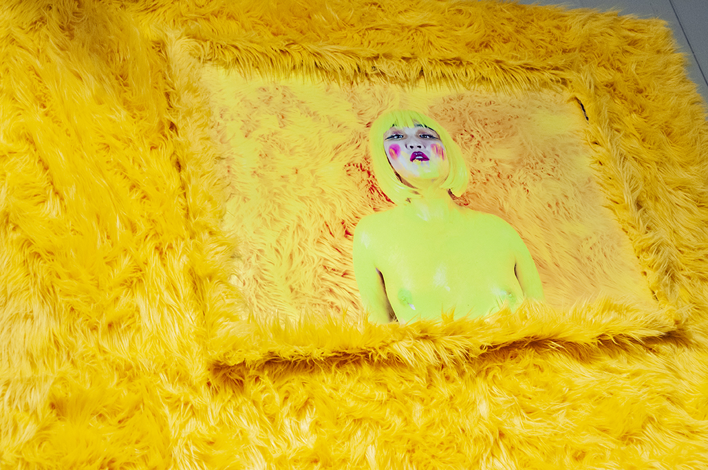   I DARE YOU TO BUY ME I   Photography Installation: Archival prints, yellow shag fur frame, yellow shag fur.  2019 LA Art Show Installation View. 