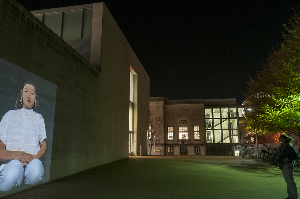  I Am Kneeling.&nbsp;  Public art installation of a 132 x 96 inch projection on the facade of Walker Hall at Washington University at St. Louis.&nbsp;  Installation view.&nbsp; 