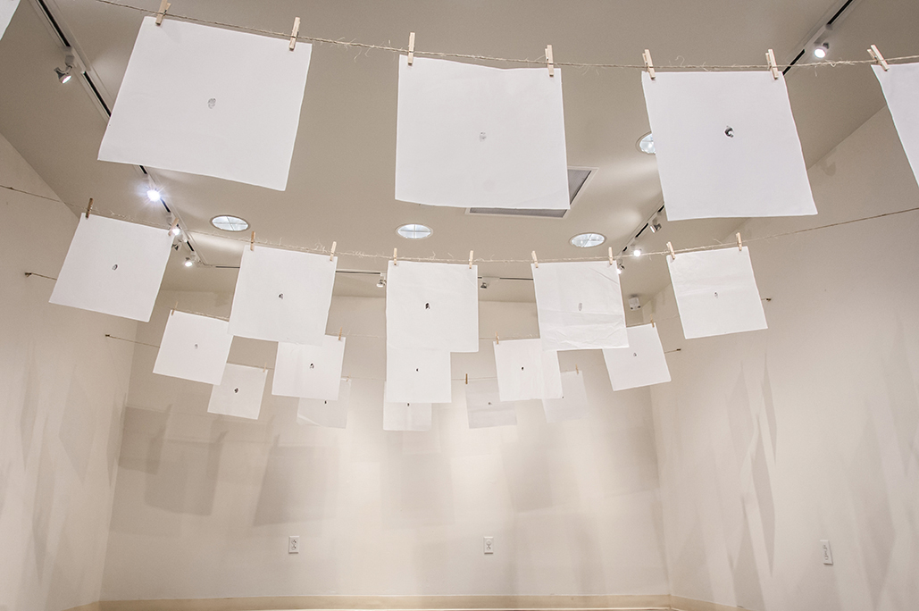지문 (jē•mōōn): Exploring Equality in South Korea. Stamped ink thumbprints on mulberry fiber paper hung from twine and clothespins.