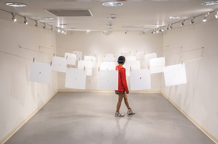  지문 (jē•mōōn): Exploring Equality in South Korea.  Stamped ink thumbprints on mulberry fiber paper hung from twine and clothespins. 