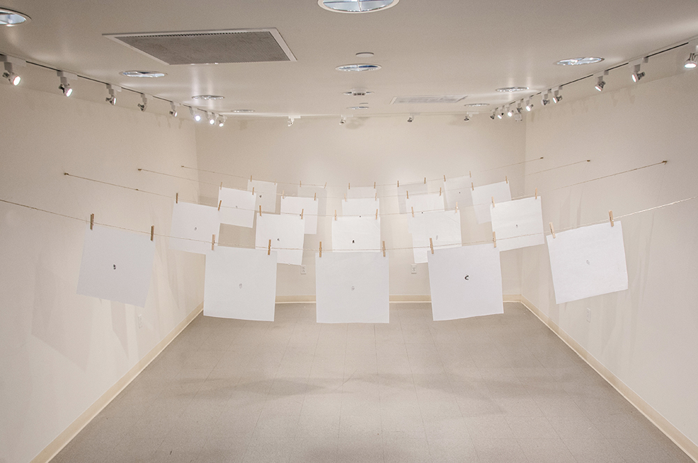 지문 (jē•mōōn): Exploring Equality in South Korea. Stamped ink thumbprints on mulberry fiber paper hung from twine and clothespins.