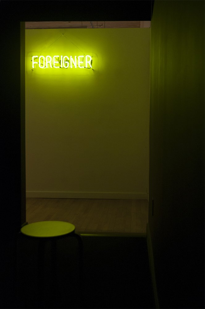  are you listening to me?&nbsp;  Multimedia installation: FOREIGNER neon sign, projector, and black box.&nbsp;  Installation view.&nbsp; 