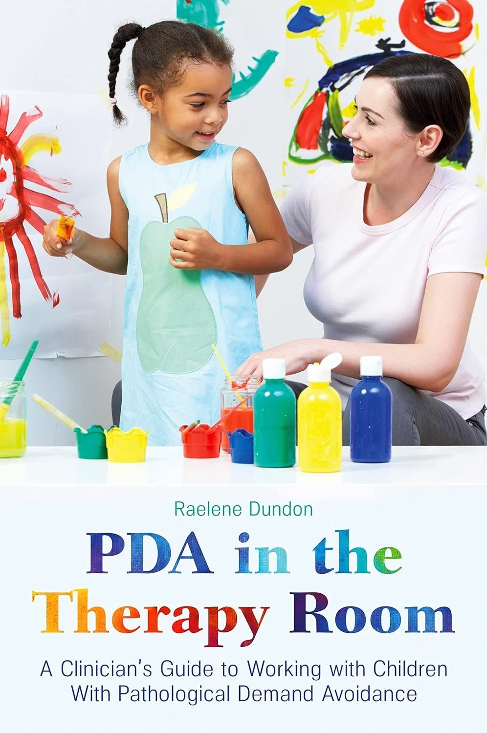 Book cover showing a child painting with an adult in a therapy setting. The book title is 'PDA in the Therapy Room: A Clinician’s Guide to Working with Children With Pathological Demand Avoidance' by Raelene Dundon.