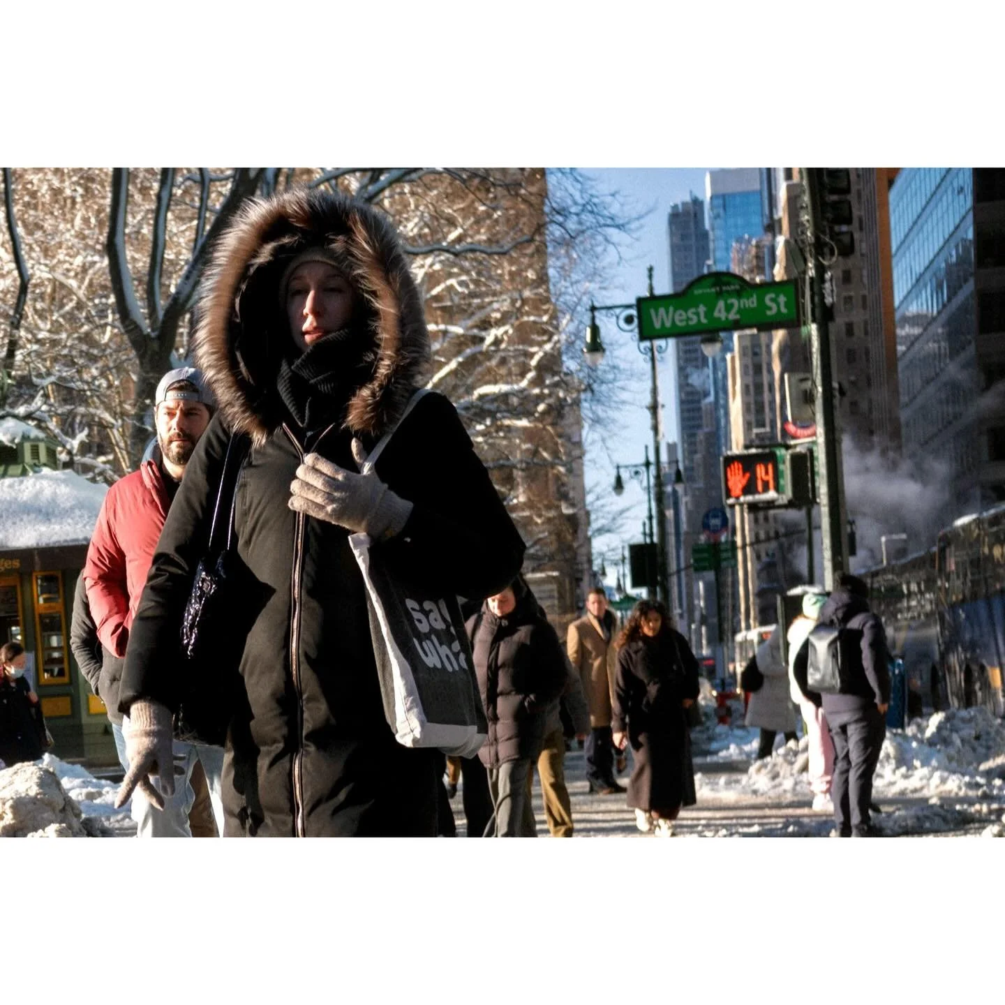 New York, a few weeks ago. There is something about the way the city exhales steam against the biting cold of a blizzard. From the school buses buried in drifts to the warning signs of falling ice, these frames are a reminder of the quiet, gritty res