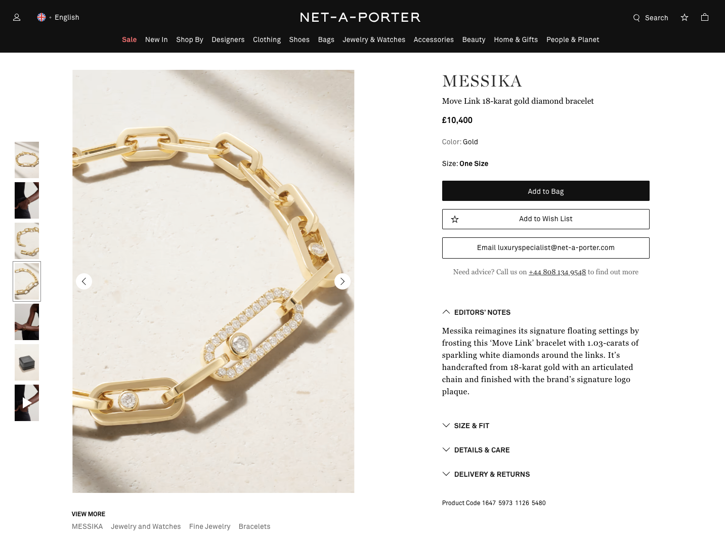 A softly lit, off-centre image of a chunky gold chain bracelet with white diamonds around some of the links.