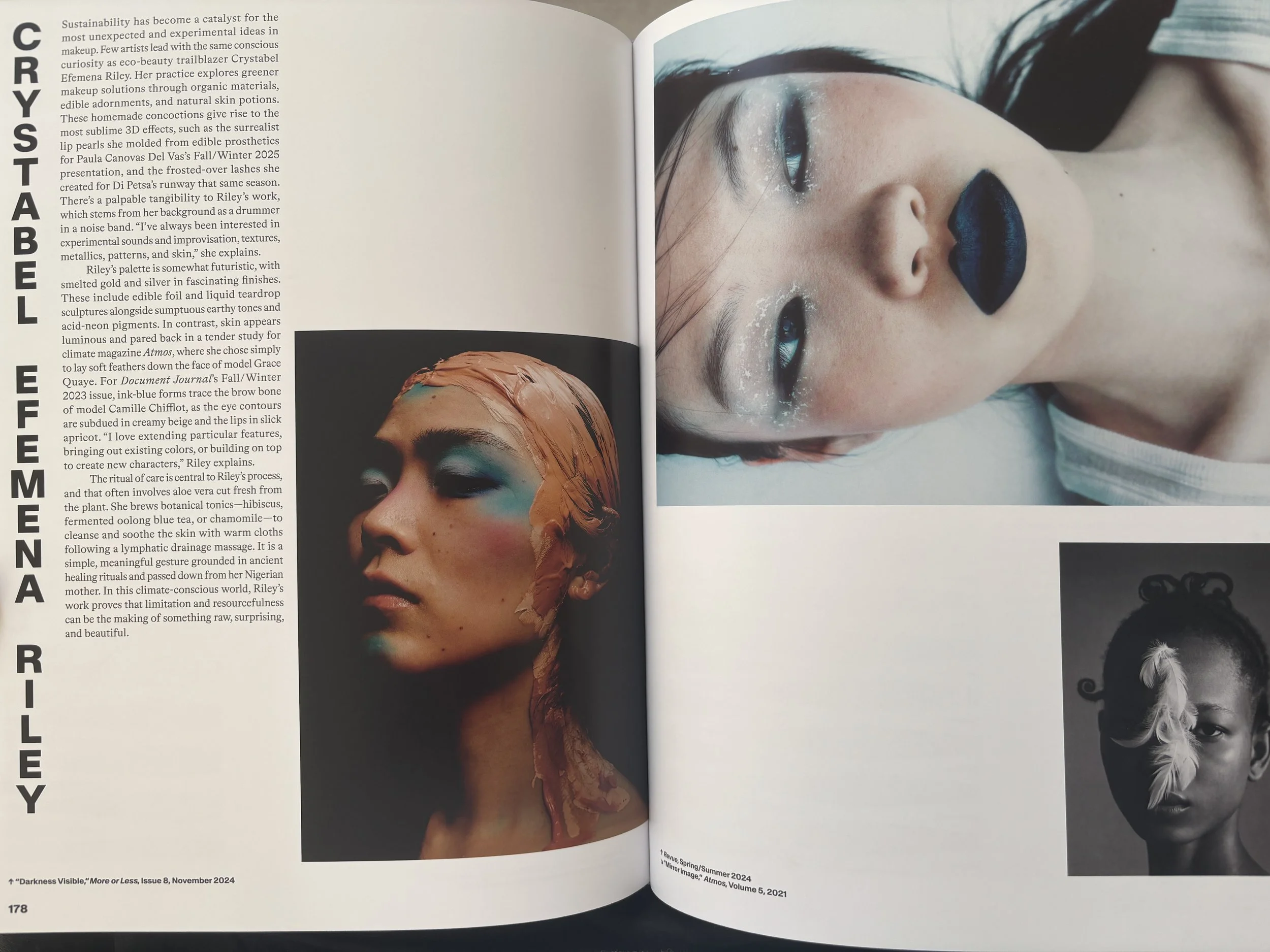 Feature on makeup artist Crystabel Efemena Riley: a shadowy face with touches of blue pigment and a clay-like mask covering her hair and nape, the other images feature a frosted, goth-style look with black lips, and a face with soft feathers down.
