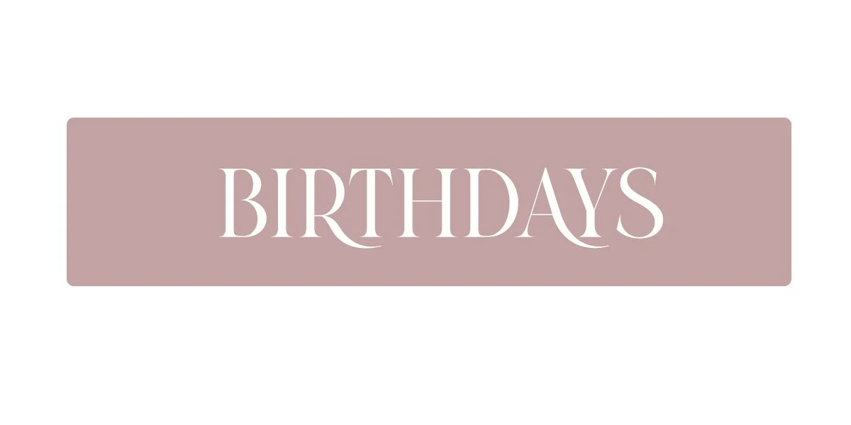 A rectangular sign with a mauve background displaying the word "BIRTHDAYS" in large, elegant white font.