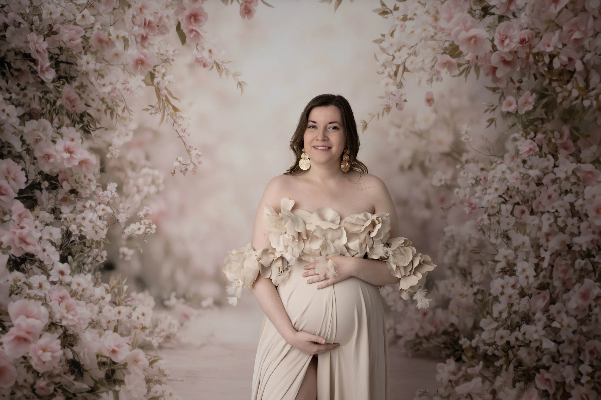 Capture the beauty of motherhood with our maternity photography. Choose outdoor or studio sessions, with partner and children welcome. Enjoy access to our client closet featuring stunning dresses, fabrics, backdrops, and accessories for a variety of 
