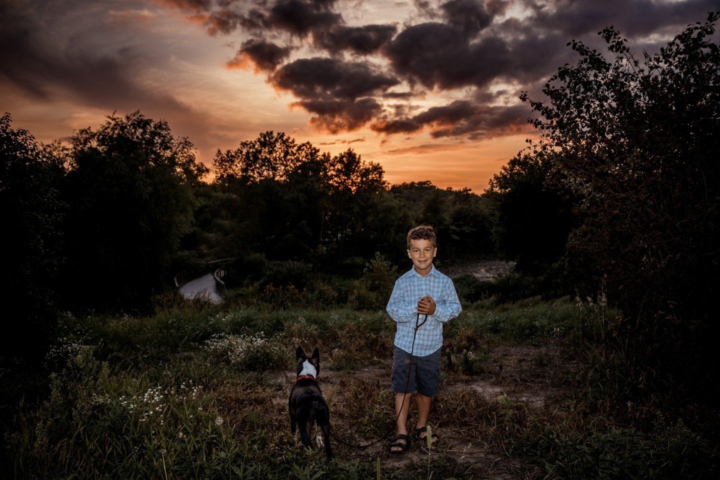 My adorable nephew and his dog who was done having his picture taken!⁠
That sky though!