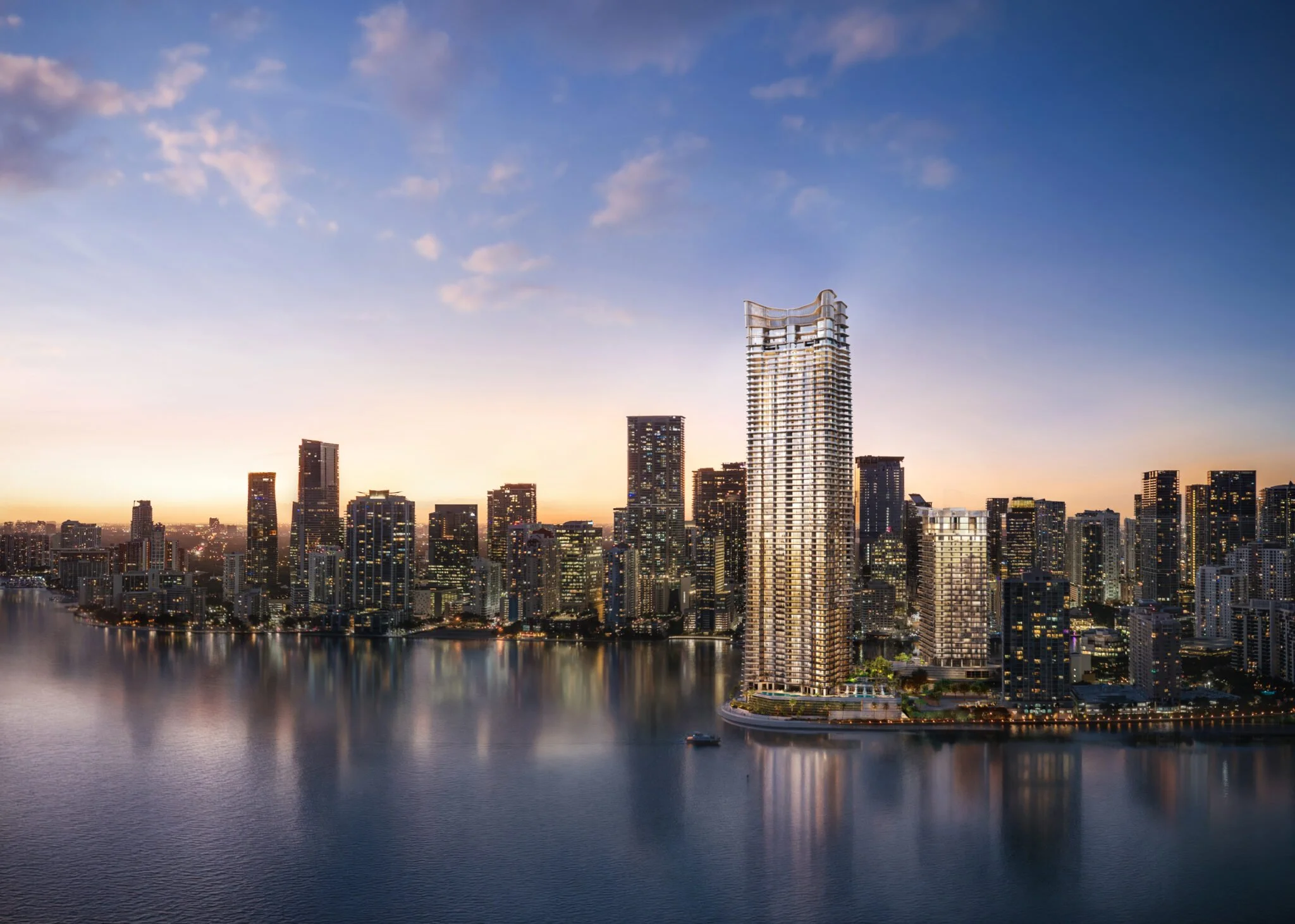 City skyline with waterfront and tall skyscrapers at sunset.