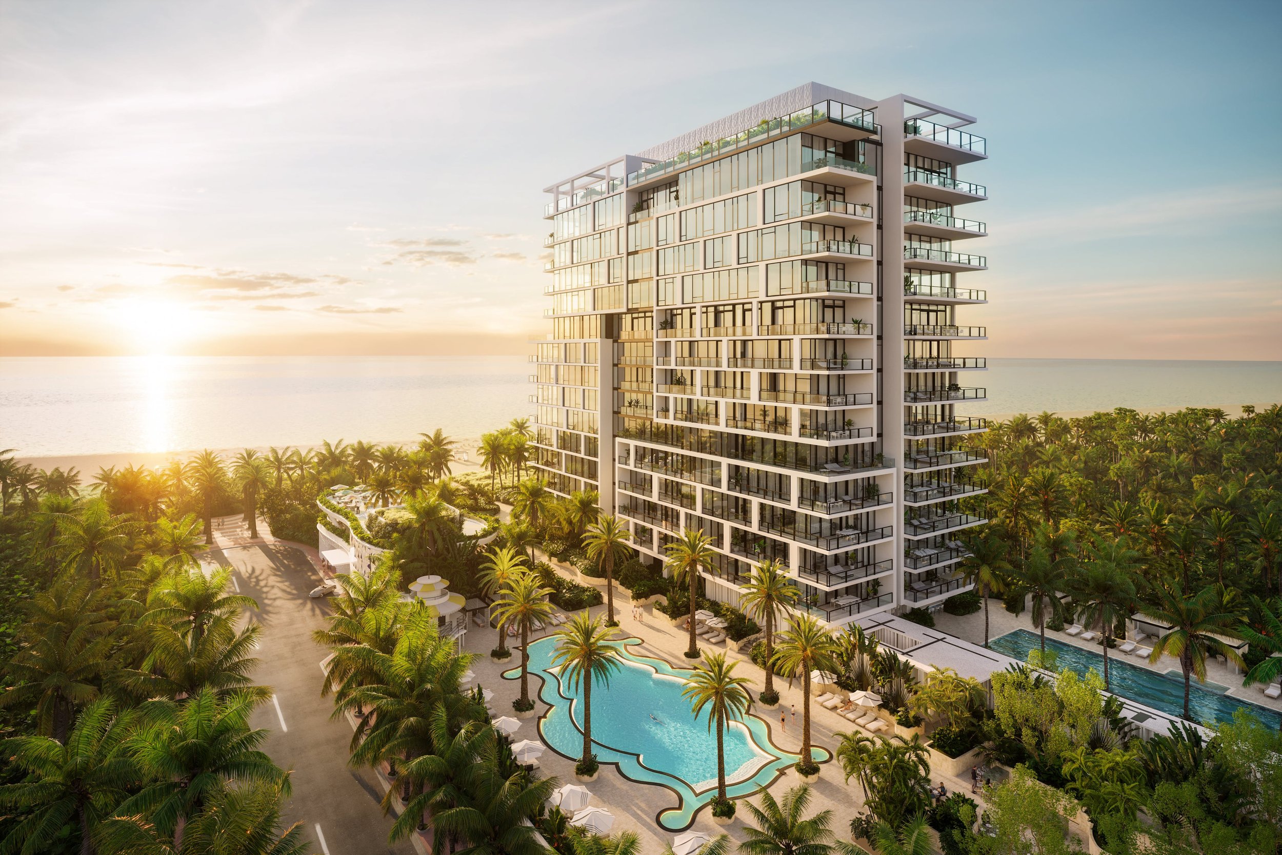 Luxury oceanfront condo building with a pool surrounded by palm trees at sunset.