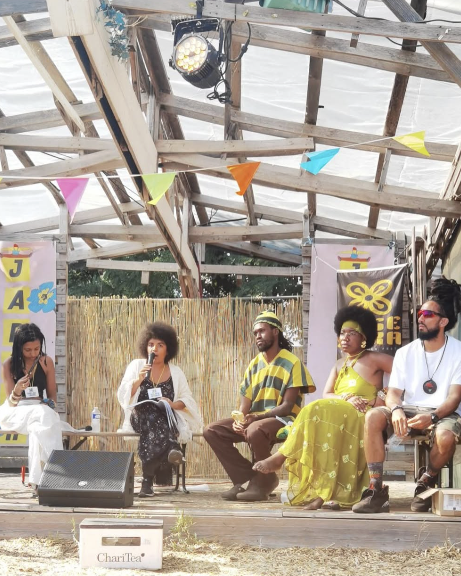 (From left to right) Maëliss Negre, Dr.Solaire Denaud, activists Kodjovi, Athéna, and Fernando Cardenas,  at the Besesaka Festival, (Afrovegan Panafrican Festical) in Paris, France, July 2026
