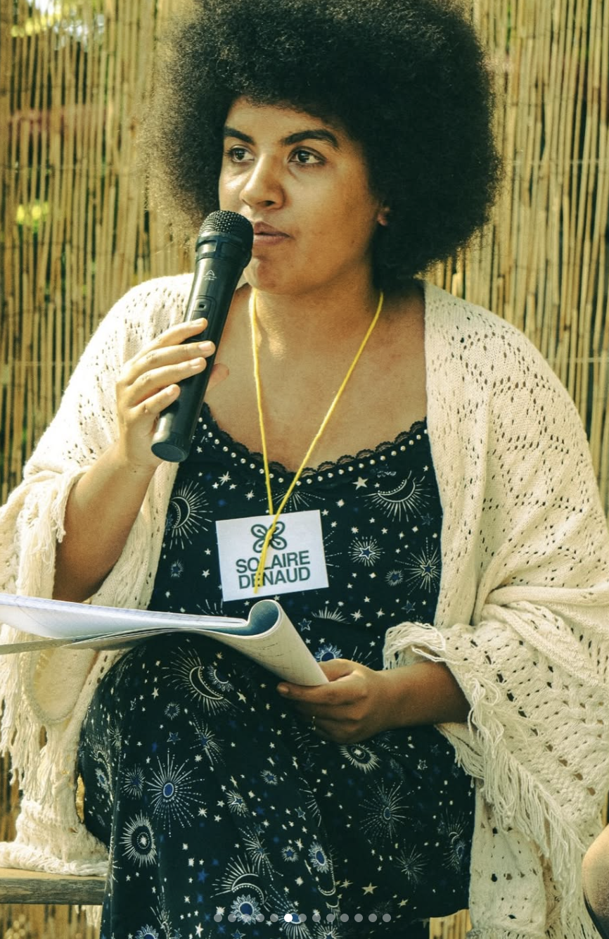 Dr.Solaire Denaud presenting at the Besesaka Festival, (Afrovegan Panafrican Festical) in Paris, France, July 2026
